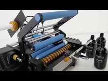 Cargar y reproducir el video en el visor de la galería, Aplicador eléctrico de etiquetas para botellas BenchMAX con dispositivo de orientación